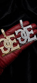 Gold and silver God Over Everything GOE pendants