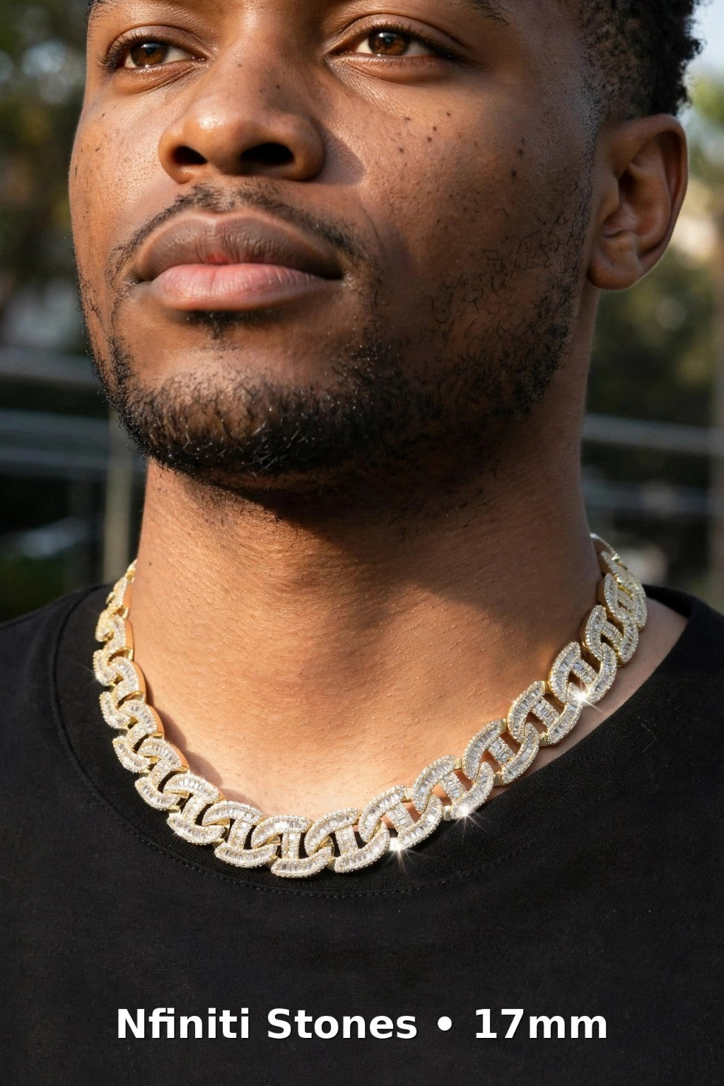 Model wearing the 17mm gold-tone Dynasty Link necklace outdoors