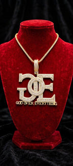 Gold color GOE pendant styled with a tennis chain