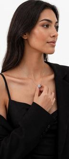 Woman holding Sunflower CZ pendant