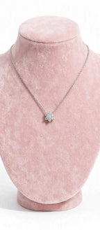 Sunflower CZ necklace on pink display