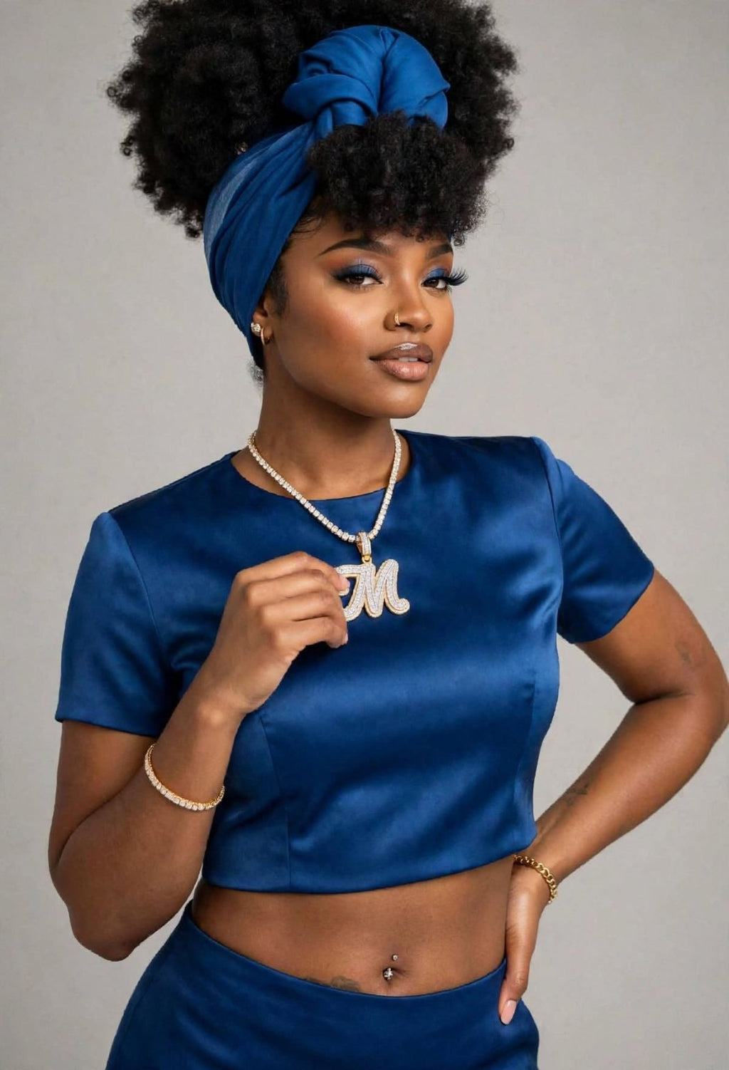 Model wearing iced M initial pendant