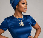 Model side pose wearing iced M pendant
