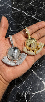 Gold and silver The Architect globe pendants together