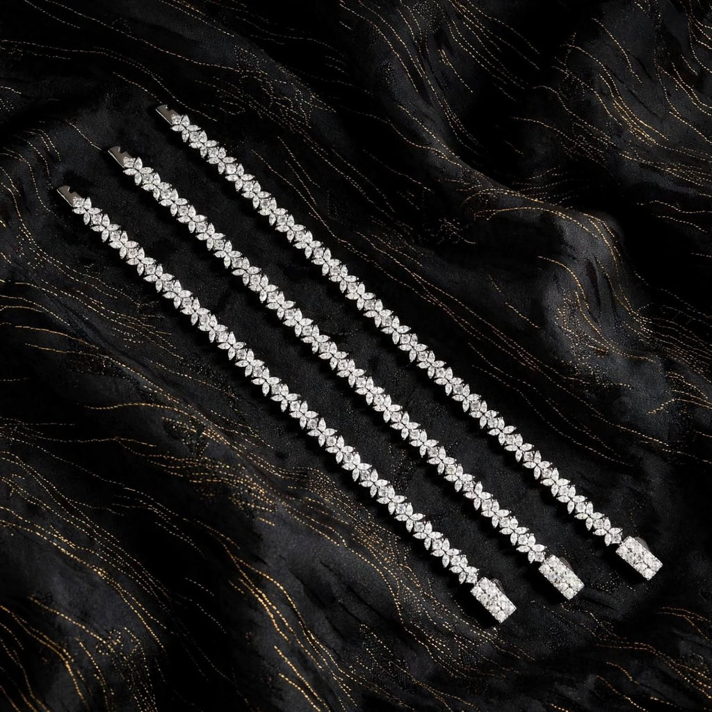 Three bracelet lengths on black fabric
