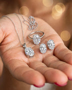 Complete oval moissanite set in hand