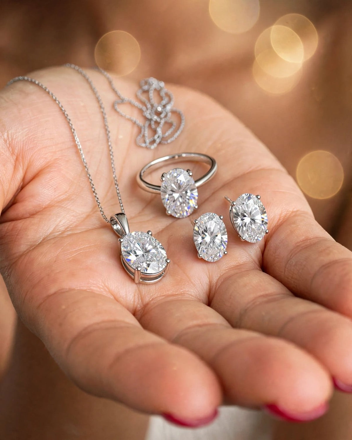 Complete oval moissanite set in hand