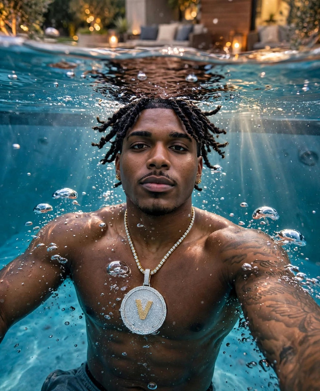 Custom iced-out disc pendant underwater lifestyle photograph