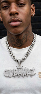 The Crown Effect custom iced-out name pendant worn by model, front view