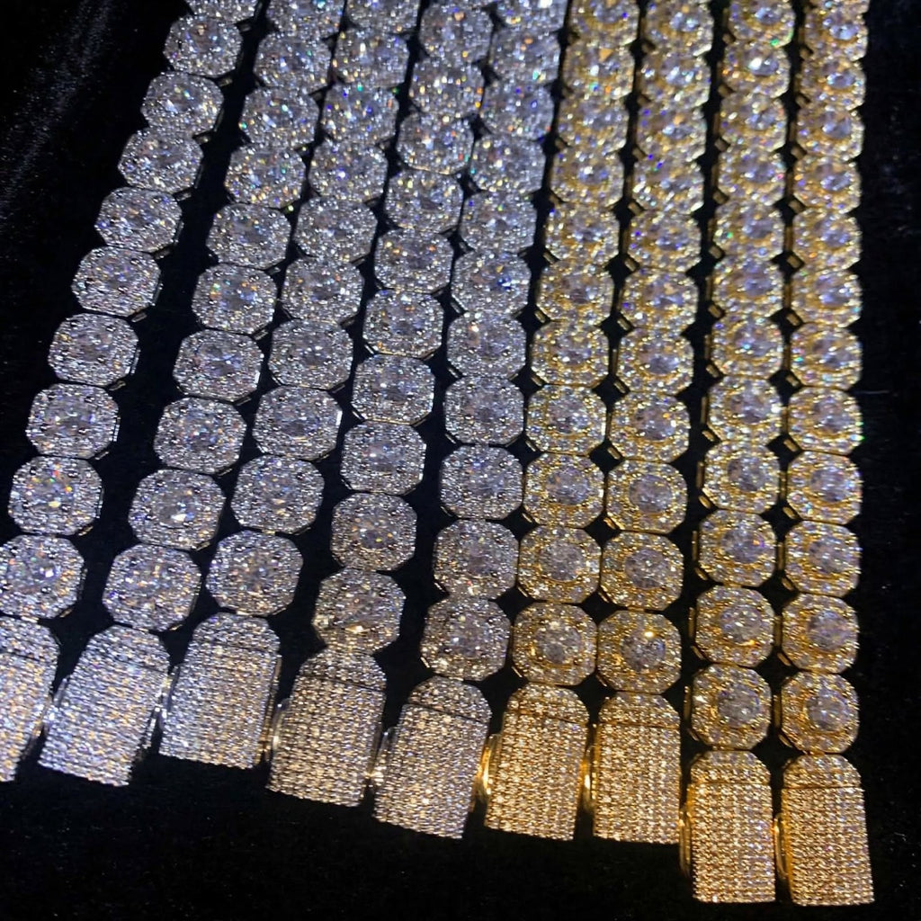 Gold and silver cluster tennis bracelets with iced clasps