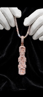 The Crown Script custom vertical bubble-letter pendant rose gold pendant on black backdrop