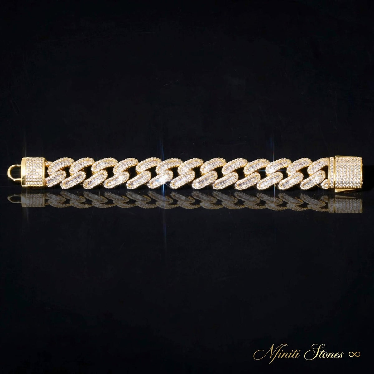 The Diplomat gold bracelet laid flat on a black reflective surface