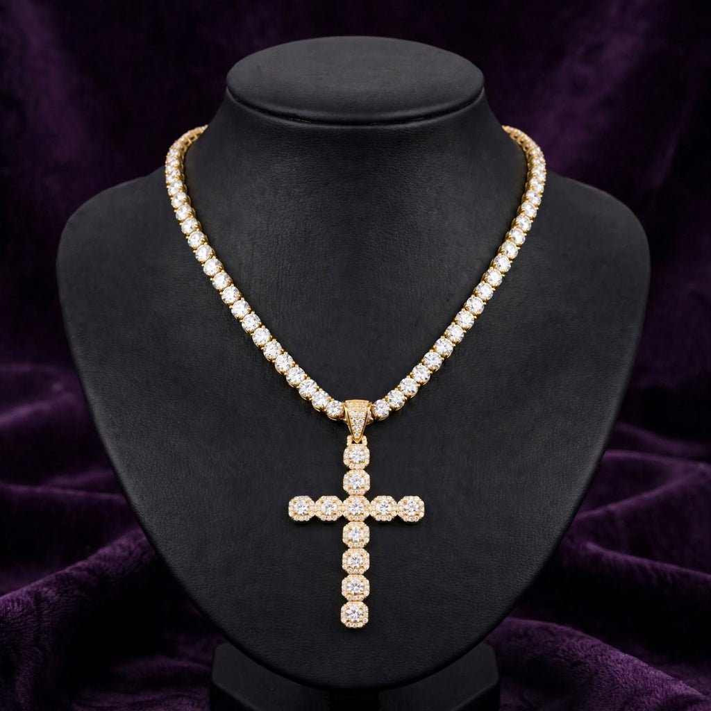 Gold tennis necklace with complimentary cluster cross pendant on black display bust