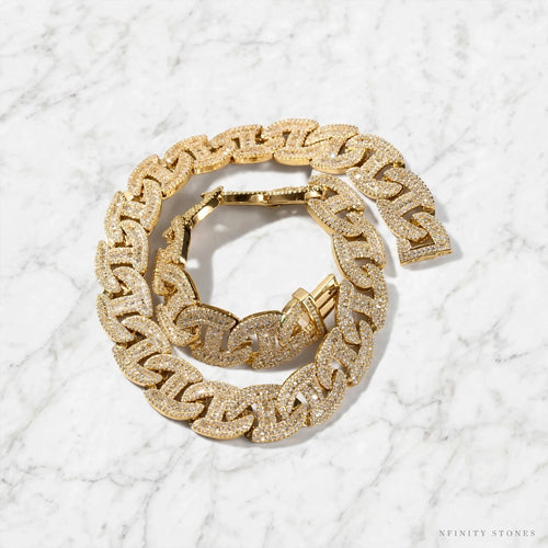 Gold-tone Dynasty Link chain and bracelet on marble