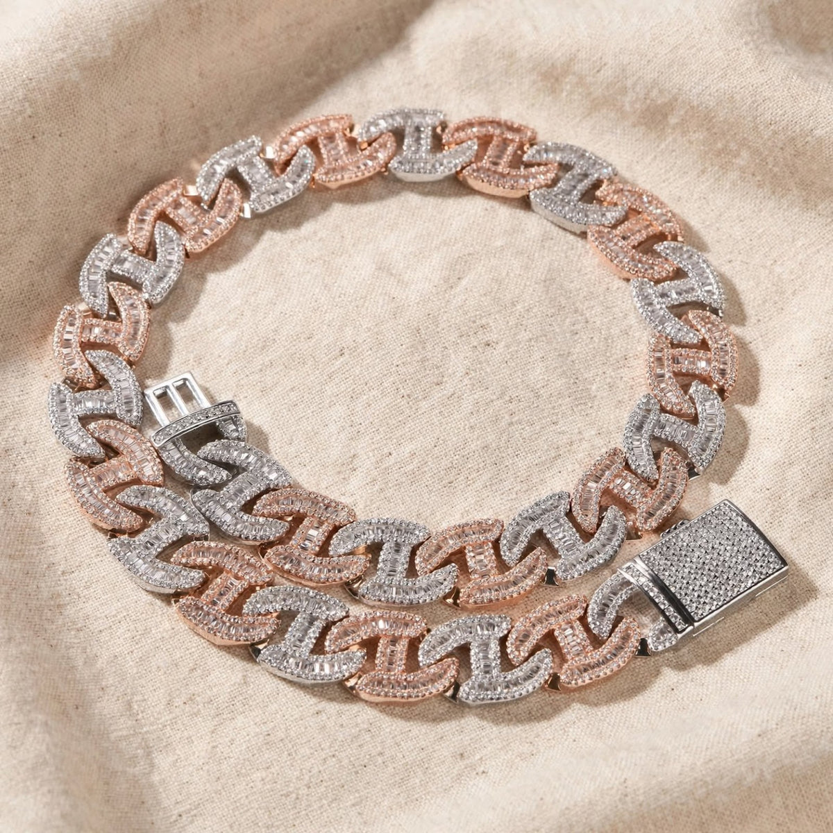 The Dynasty Link in rose gold and silver tones on cream fabric