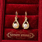 The Eternal Pearl gold-colored matching earrings detail