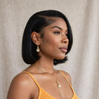 The Eternal Pearl gold-colored necklace and matching earrings worn together