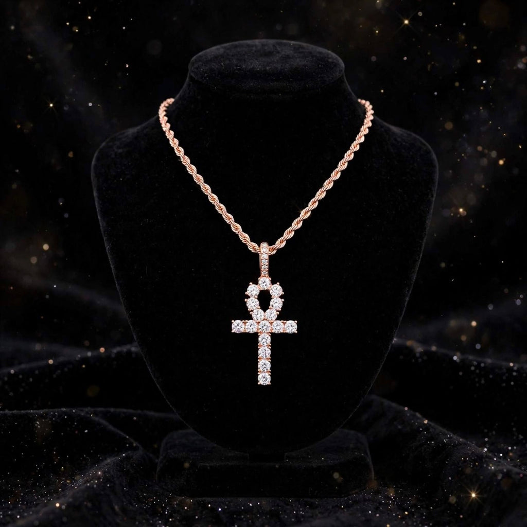 Rose gold ankh pendant on rope chain displayed on black bust