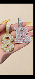 Gold S and silver / rose R pendants
