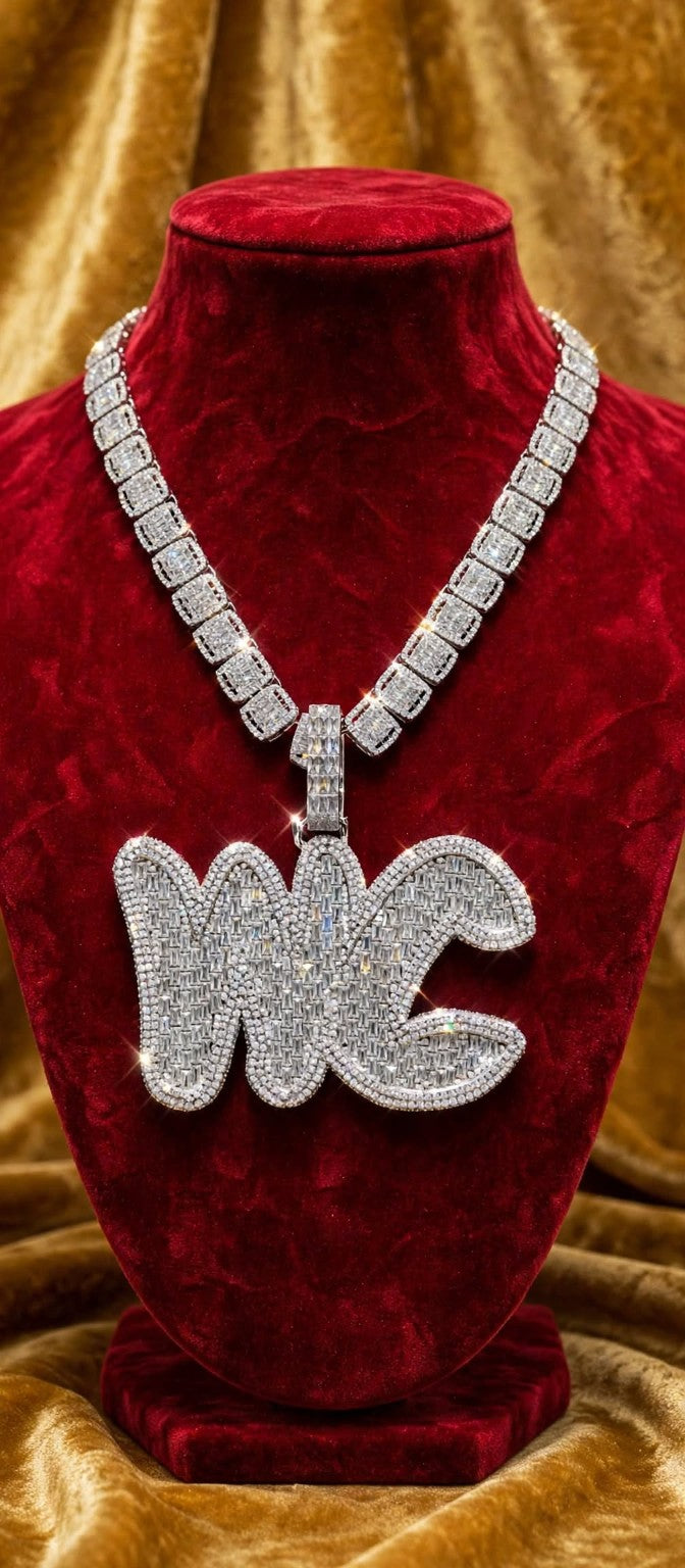 The Full Court Pressure baguette custom iced pendant on burgundy velvet mannequin with matching chain