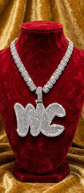 The Full Court Pressure baguette custom iced pendant on burgundy velvet mannequin with matching chain