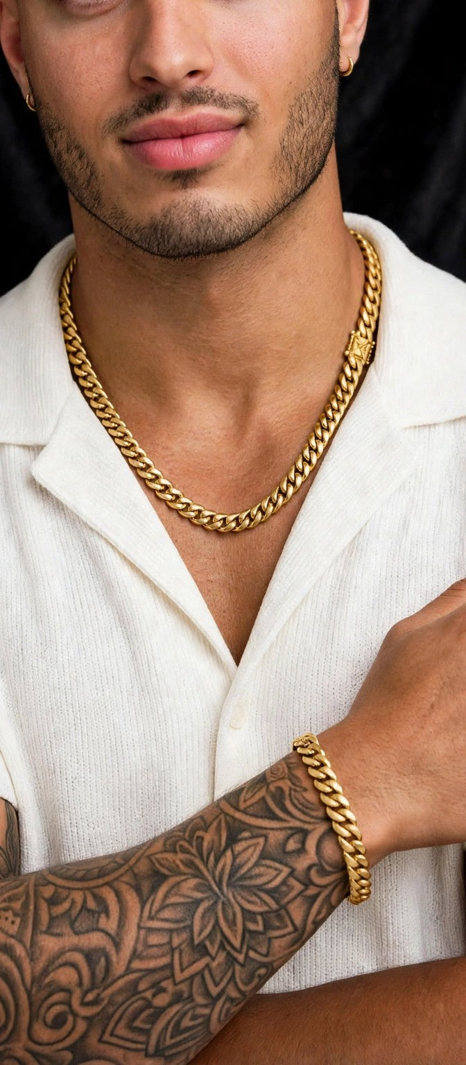 The Golden Rule gold Cuban-link necklace close-up on male model; bracelet shown for styling only