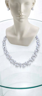 The Grand Affair white necklace and matching earrings mannequin display