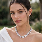 The Grand Affair white necklace and earrings worn by a model