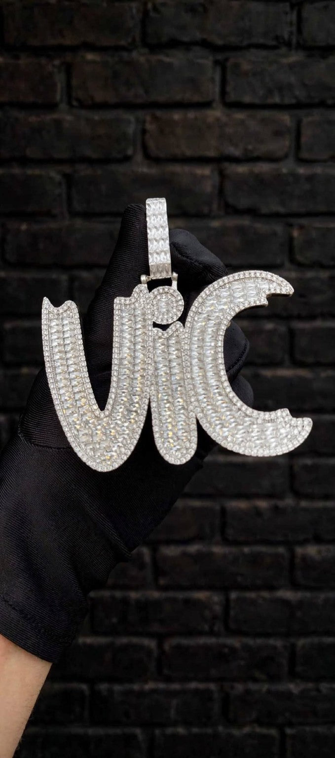 The Graveyard Shift VIC pendant close-up in black glove