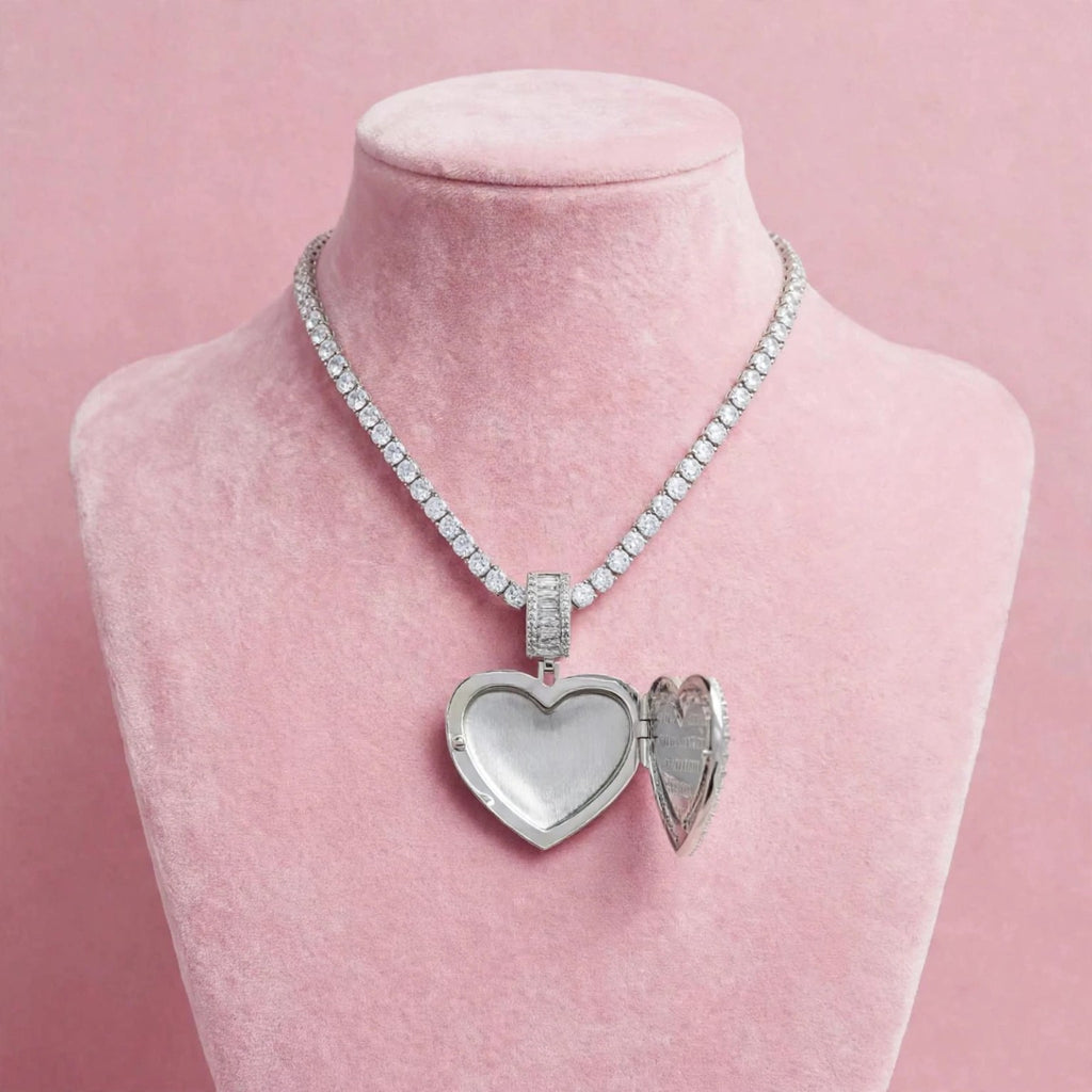 The Heart Keeper silver-tone open photo locket displayed on pink velvet