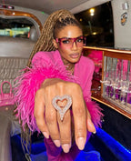 Model wearing a rose gold finish iced open heart ring