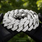 The Ice Syndicate silver Cuban chain held outdoors