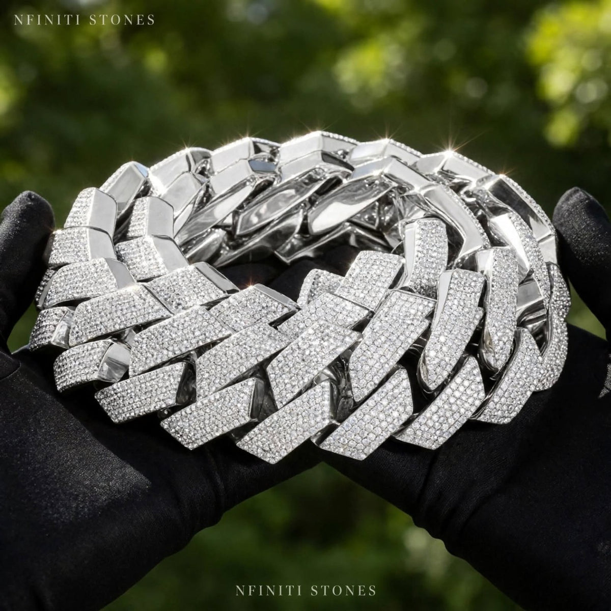 The Ice Syndicate silver Cuban chain held outdoors
