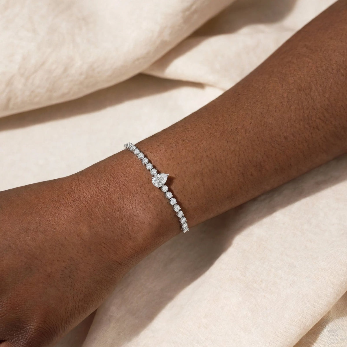 Pear cut Infinite Grace bracelet on wrist