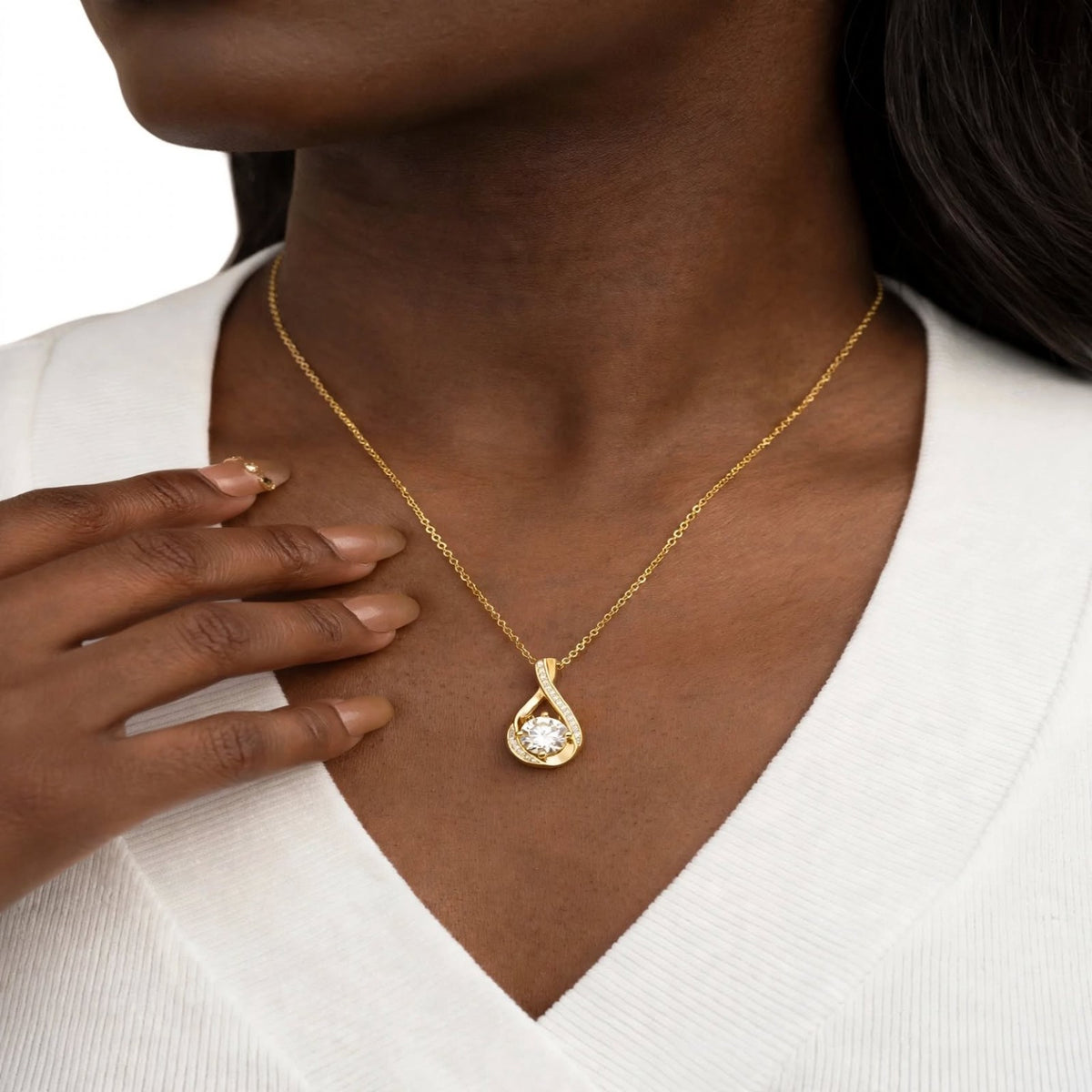 Gold and silver infinity pendants