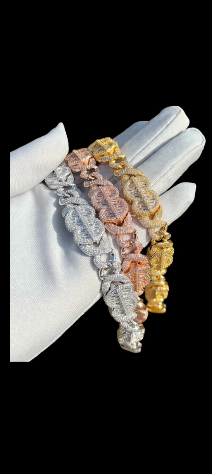 Three bracelet finishes shown on a white glove