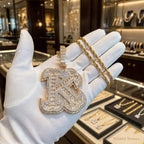 The Iron Letter gold K pendant; chain shown is not included