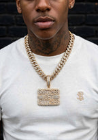 Alternate lifestyle model wearing stacked-letter pendant