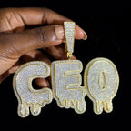 The Drip custom gold iced-out CEO pendant, straight-on front hero photograph