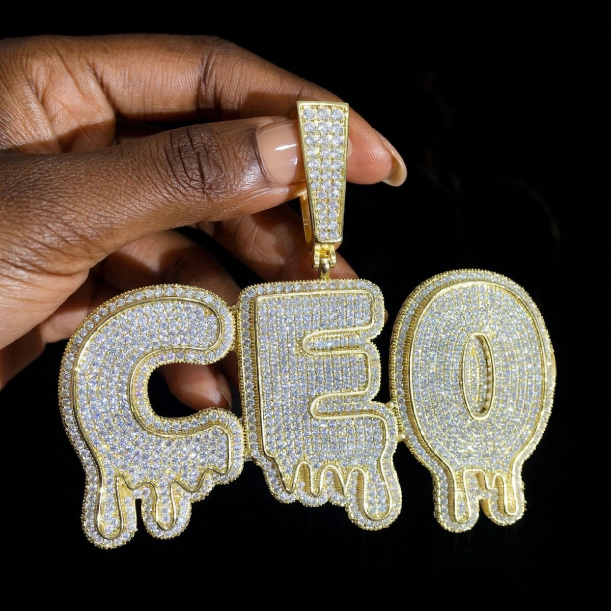 The Drip custom gold iced-out CEO pendant, straight-on front hero photograph