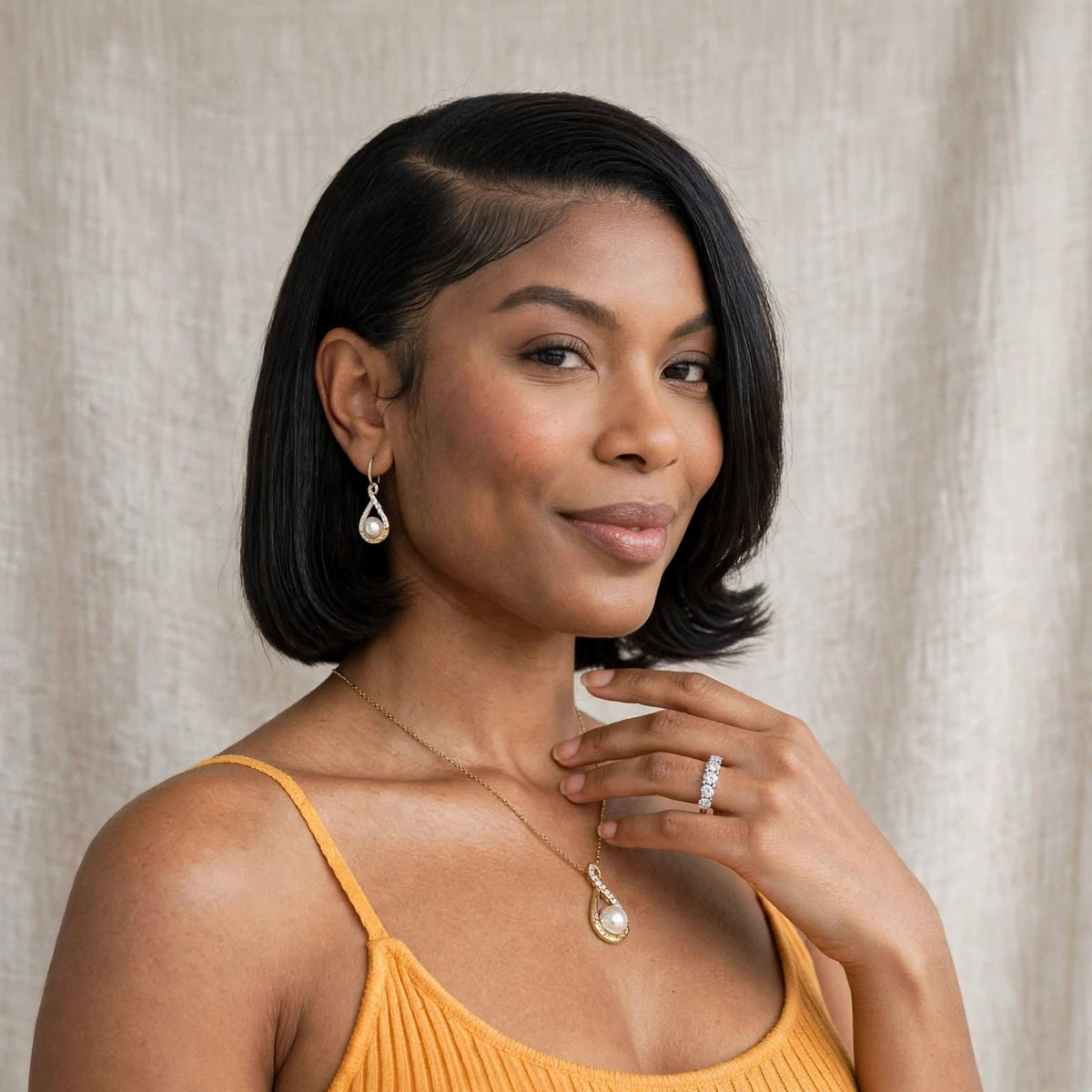 Model wearing the Nfiniti Five-Stone Moissanite Band; necklace and earrings sold separately