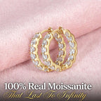 Gold finish Nfiniti Radiance moissanite hoops on pink velvet