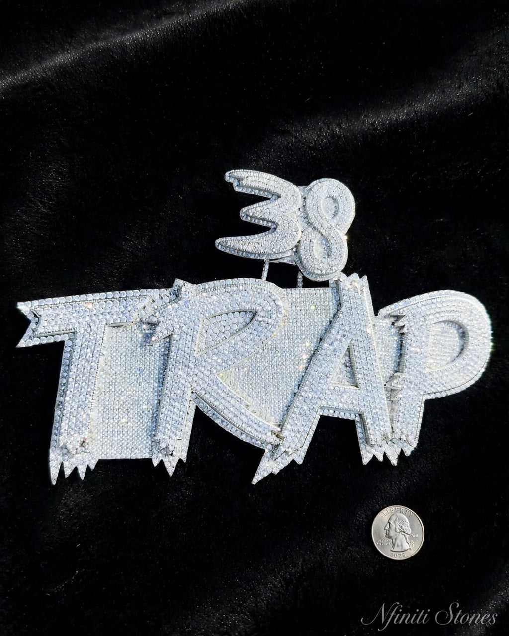 TRAP pendant on black fabric with scale reference