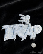 TRAP pendant on black fabric with scale reference