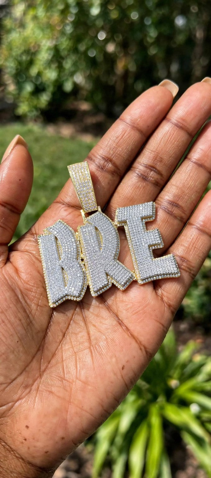 Custom double-layer BRE pendant held outdoors