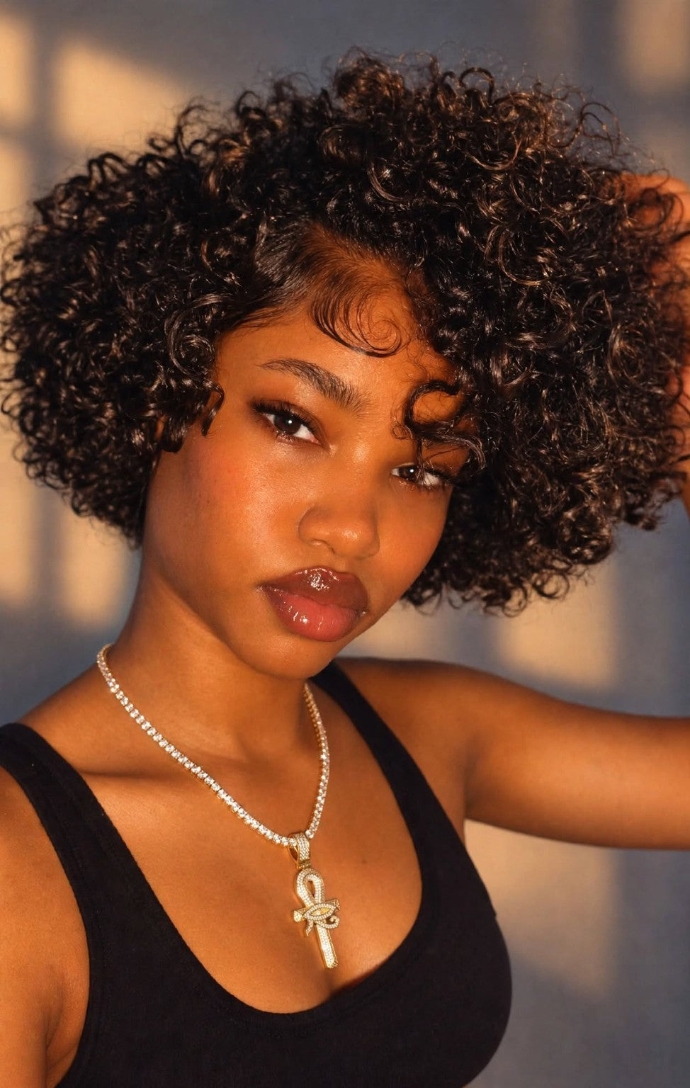 Gold ankh pendant with tennis necklace on model