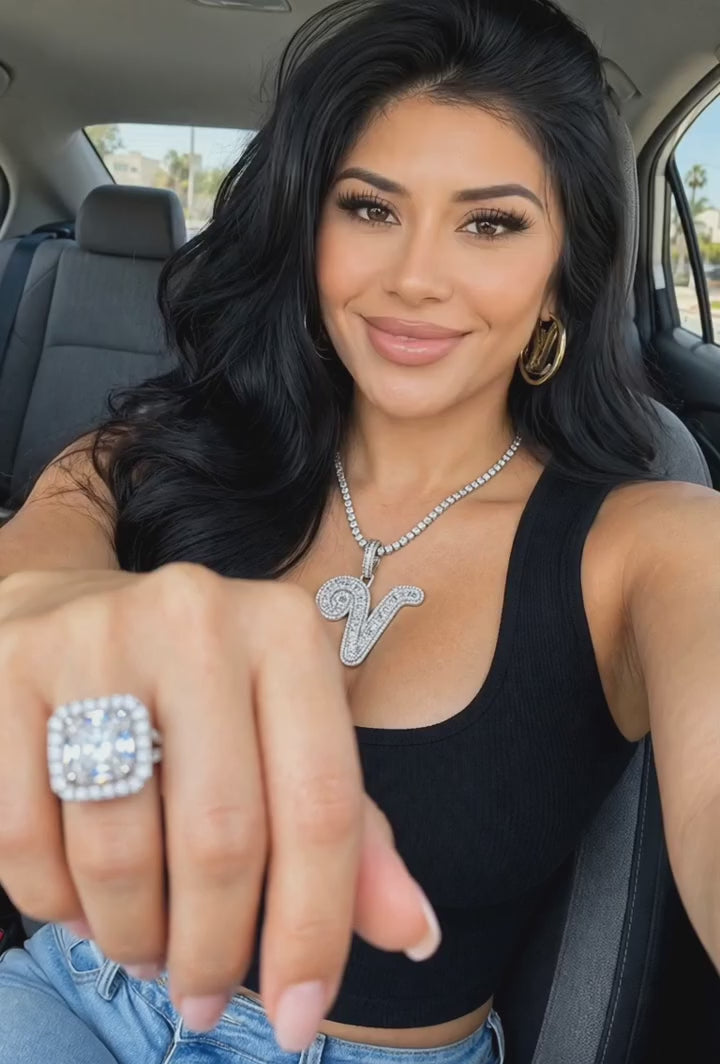 Nfiniti Stones jewelry video — woman showing a ring and letter pendant