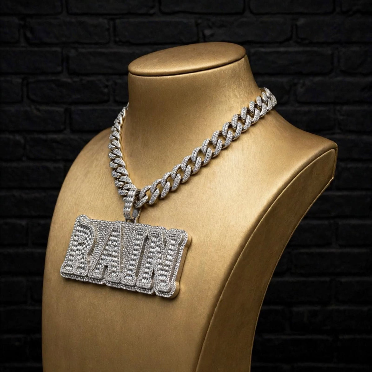 RAIN custom pendant on gold display bust, angled view