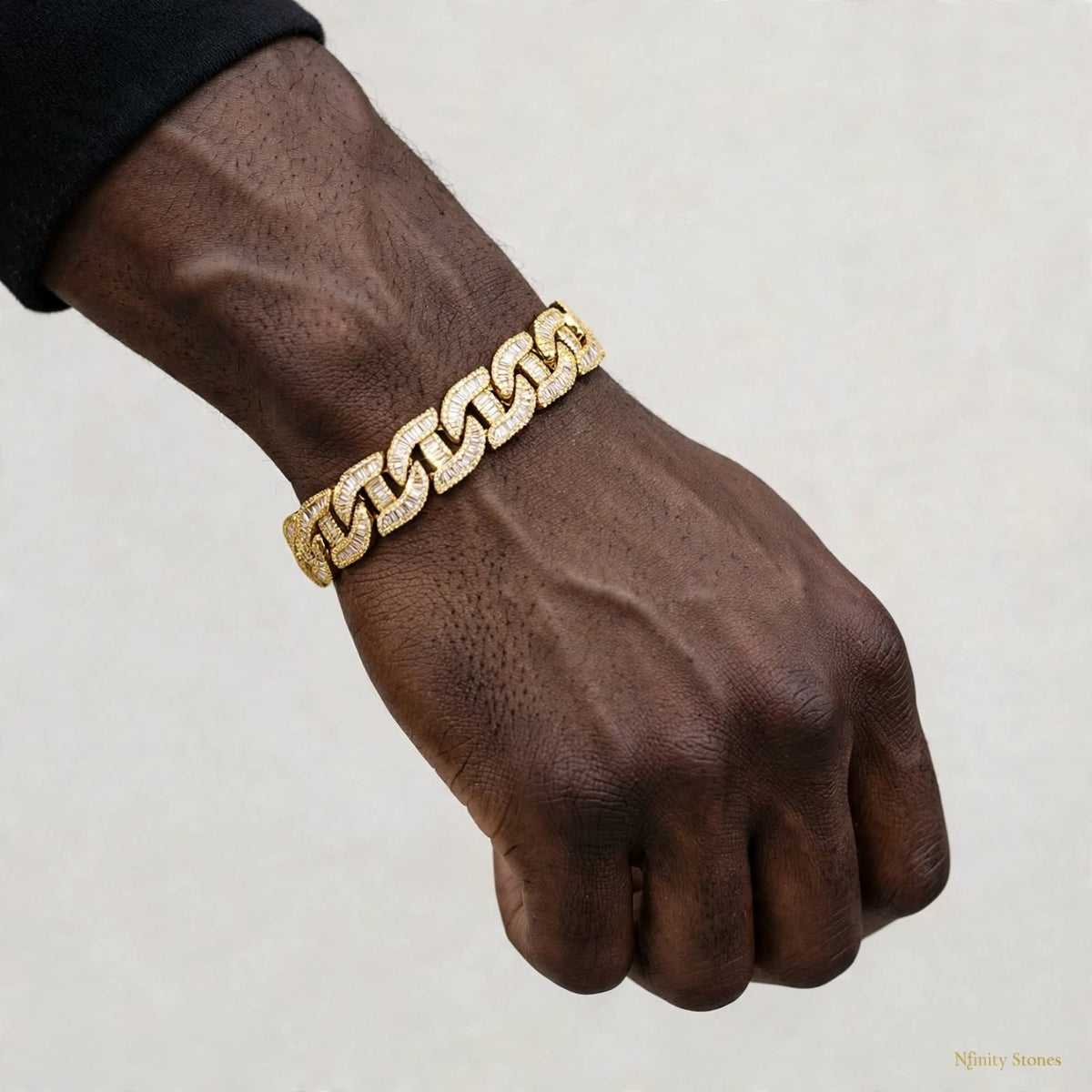 The Royal Affair gold bracelet on wrist, full hand view