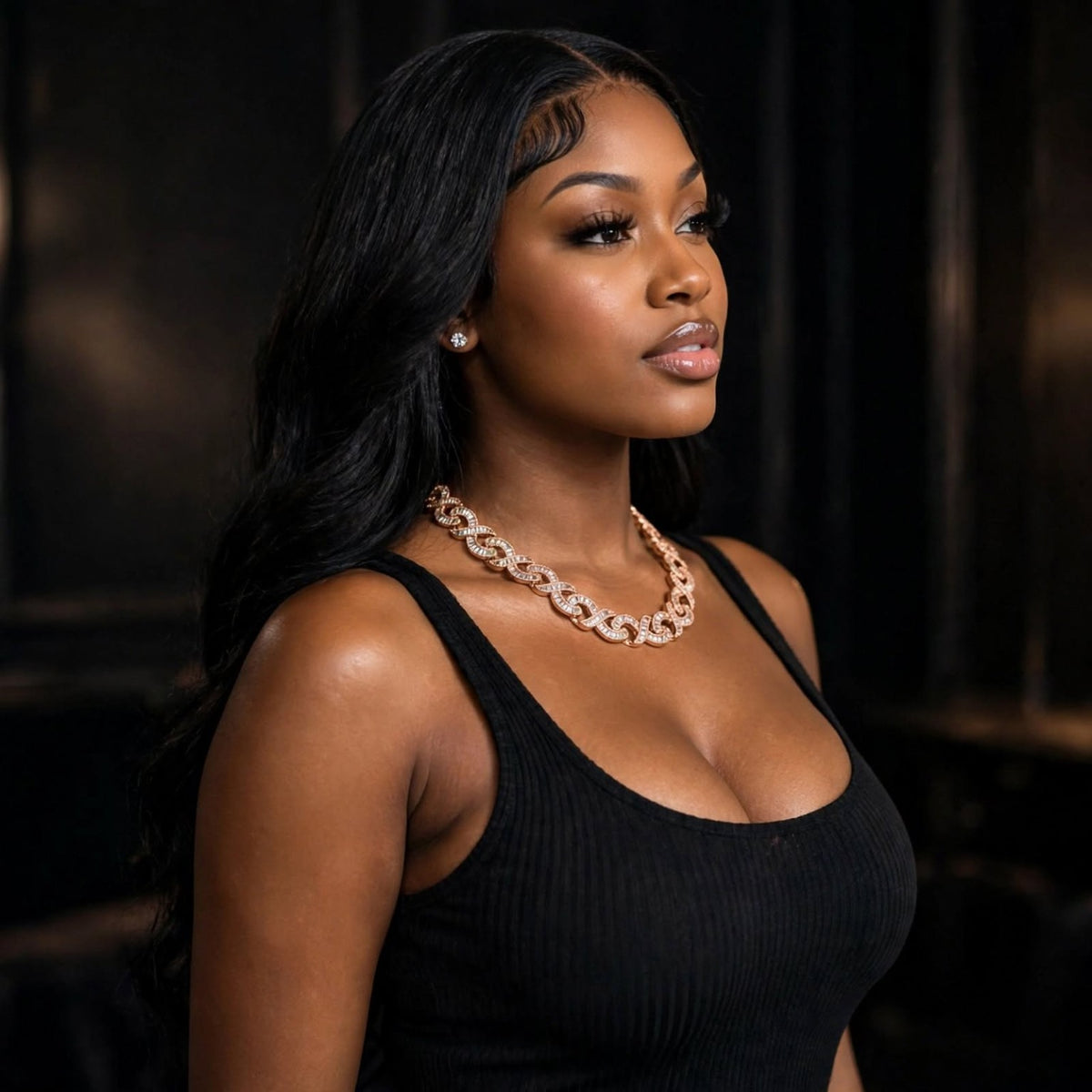 Side view of model wearing rose gold infinity-link chain